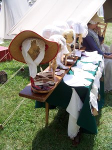 Table with caps on display in the sun. 