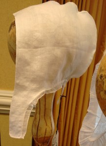 The one-piece lappet has a small ruffle along on the bottom.