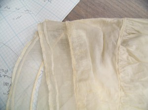 CF of cap showing ruffle and headpiece details. 