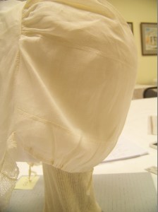 Linen cap, detail of back. 