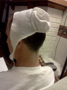 Very small cap shown on adult head. 