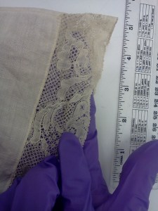 Lace edges the front of this 18th C cap. 