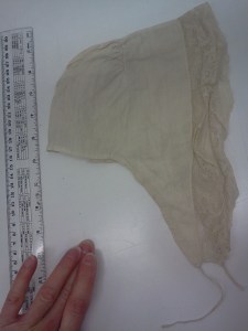 Small 18th C cap of linen, with lappets. 