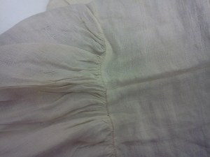 Close-up of top of cap where headpiece and caul are joined. 