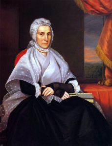 18th C portrait of Mrs. Bostwick in a black gown with a lappet cap. 