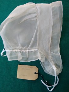 Saines repro includes doubled headpiece like the original. 