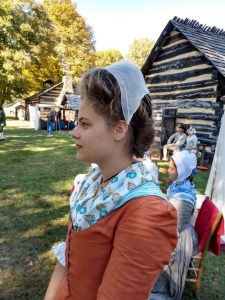 young woman modeling the wedding cap on dressed hair