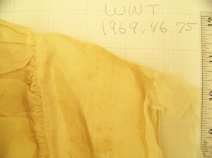 Detail of the top of the cap showing the outside, with the close and even stroke gathers. 