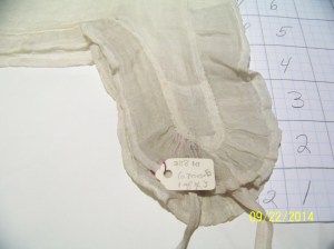 Close up of end of lappet of Smithsonian 18th C cap. 