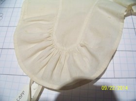 Detail of gather at lappet tip. 