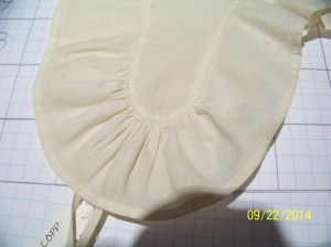 Detail of gather at lappet tip. 