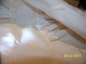 Inside of 18th C cap from Smithsonian showing stitches and construction.