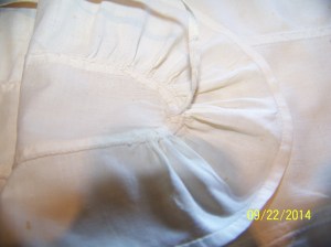 Inside of lappet tip shows awkward folding at turn. 