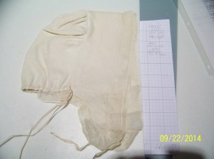 Lappet cap shown on graph paper for size. 