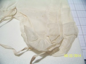 Close up of ruffles at the tip of the lappet. 