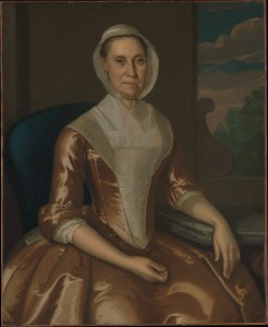 18th c portrait of woman in plain brown gown with lappet cap.