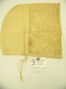 Cap McCord Museum #M980.4.26 photo by author. A rectangular headpiece of lace marks this cap as early (or late?) 18th C.